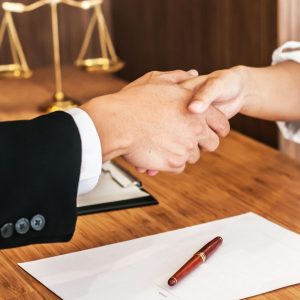 Frisco criminal defense attorney discussing legal defense strategy with client